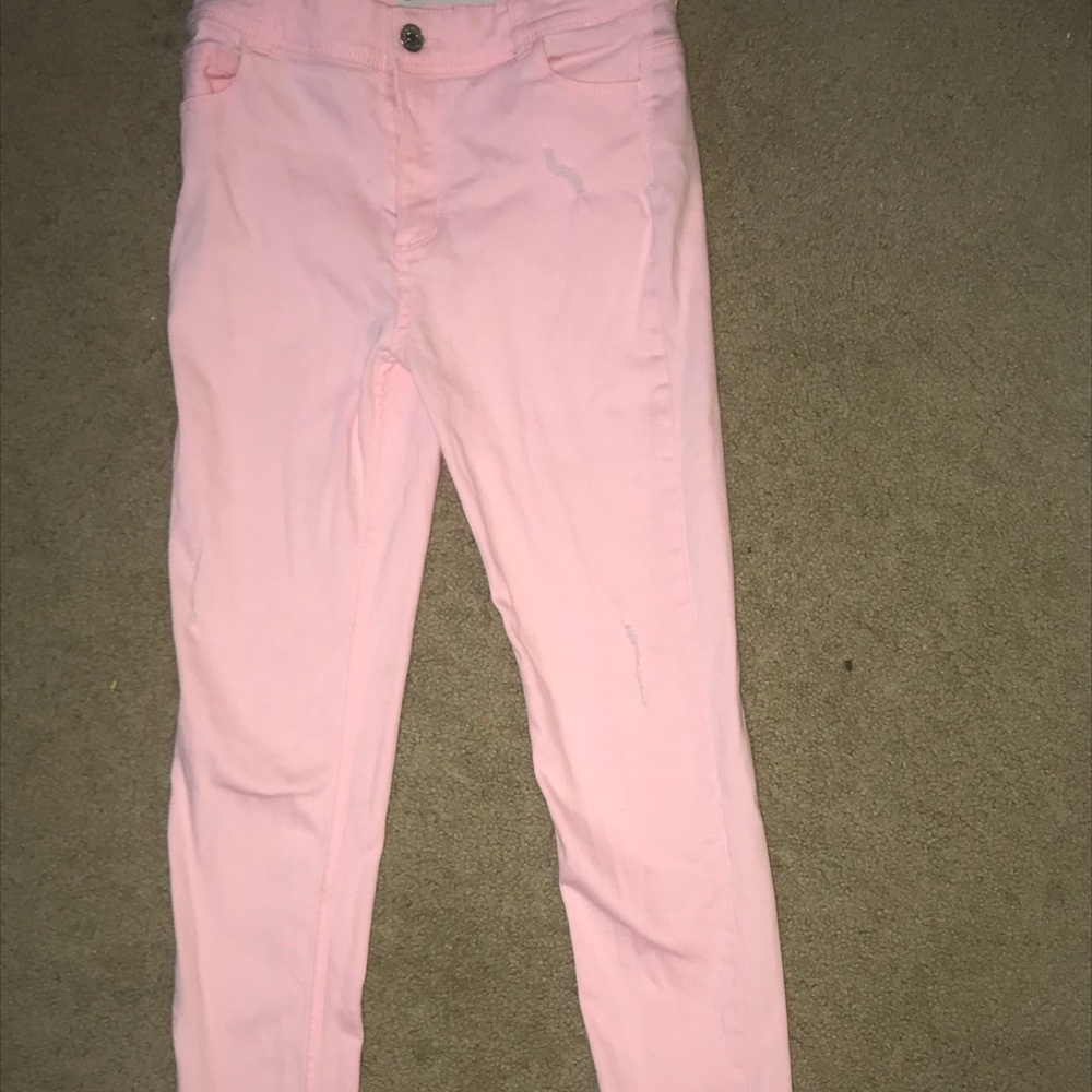Pink ripped skinny jeans